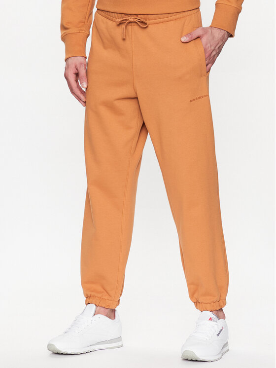 New Balance Sportinės kelnės · Oranžinė · Relaxed Fit