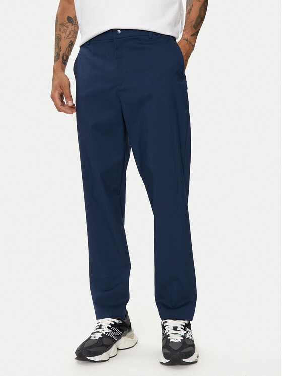 New Balance Medžiaginės kelnės · Tamsiai mėlyna · Regular Fit