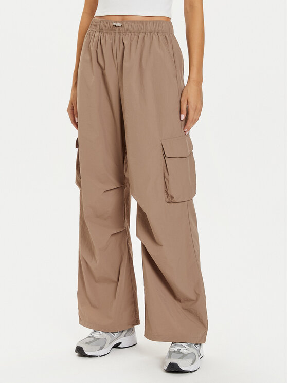 New Balance Sportinės kelnės · Smėlio · Relaxed Fit